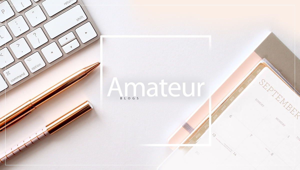 Golden pens with a golden keyboard and calendar with the inscription: Amateur Blogs